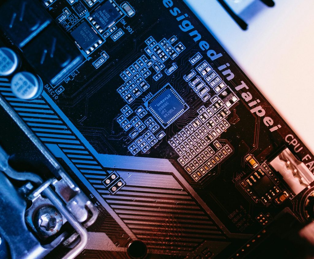 Macro shot of a computer motherboard focused on chips and circuits, designed in Taipei.